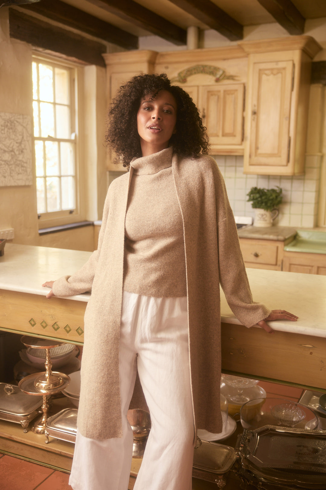 Model wearing oatmeal Lucerne Cardi, lifestyle view