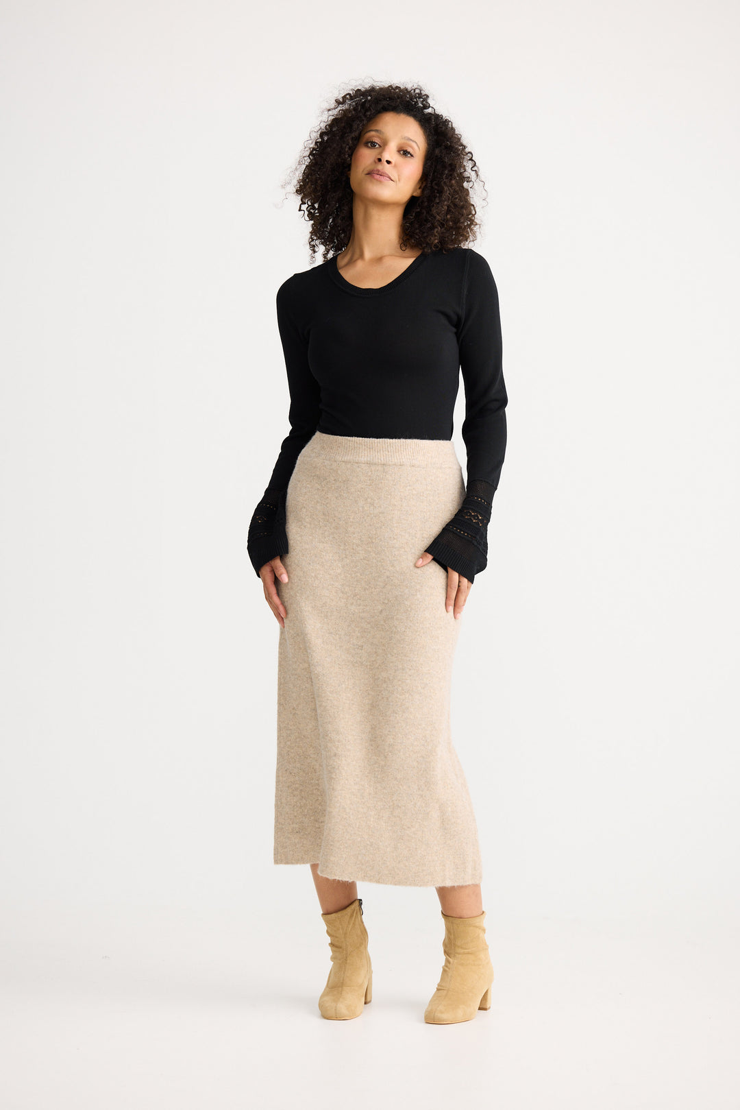 Model wearing oatmeal Lucerne Knit Skirt, detail view on white background