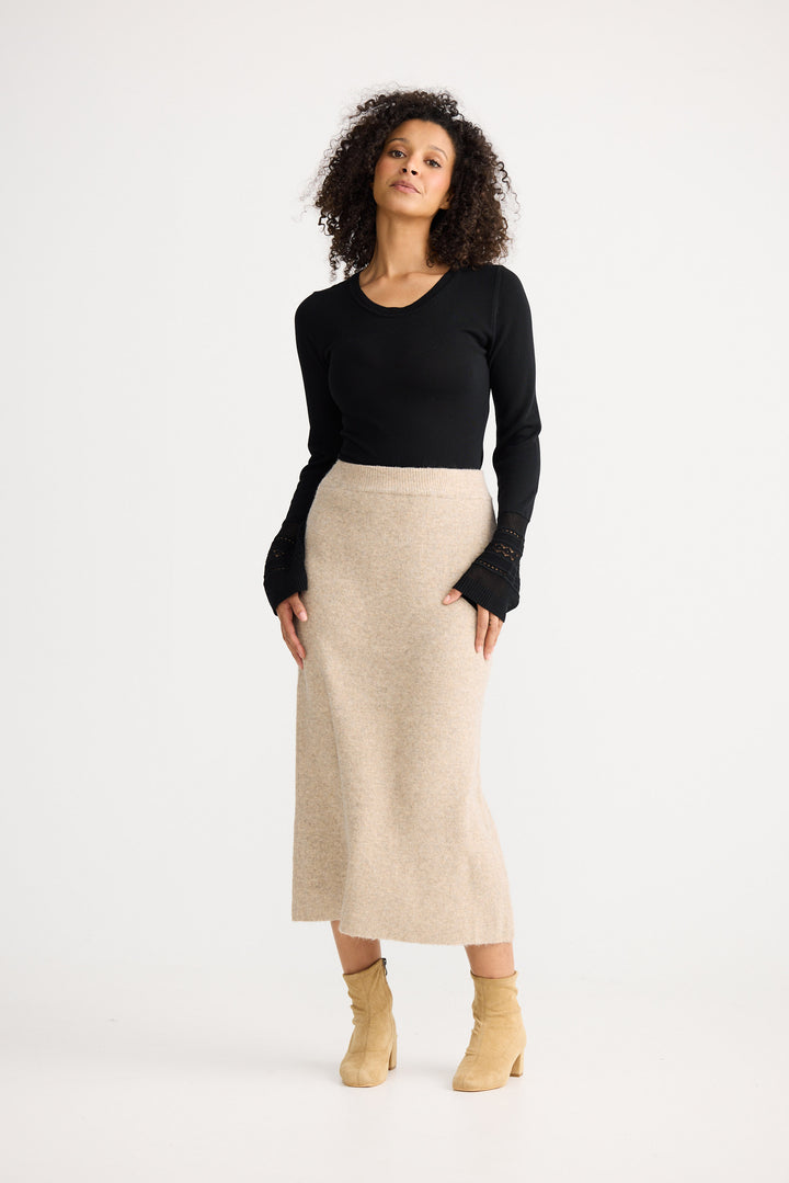 Model wearing oatmeal Lucerne Knit Skirt, detail view on white background