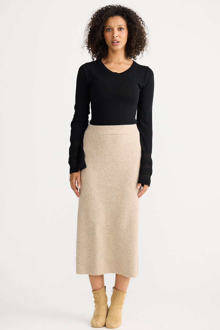 Model wearing oatmeal Lucerne Knit Skirt, angled front view on white background