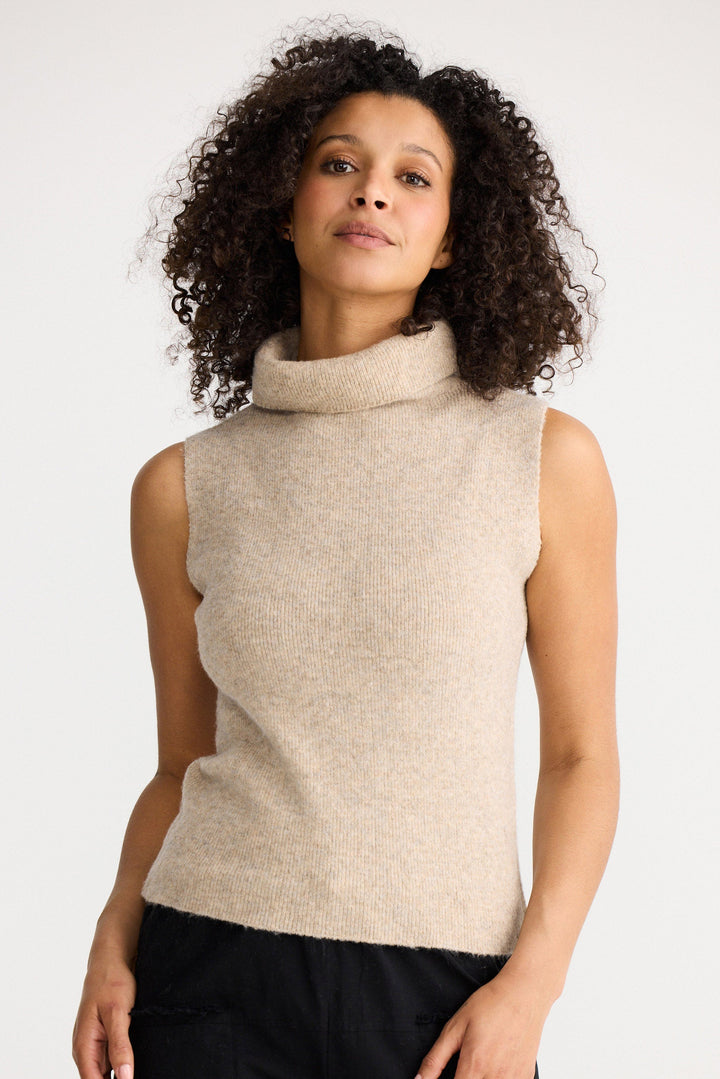 Model wearing oatmeal Lucerne Knit Top, front view on white background