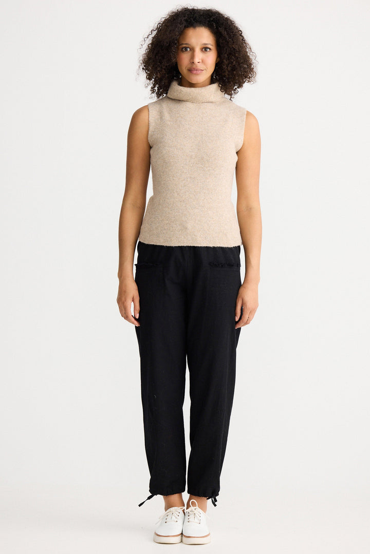 Model wearing oatmeal Lucerne Knit Top, angled front view on white background