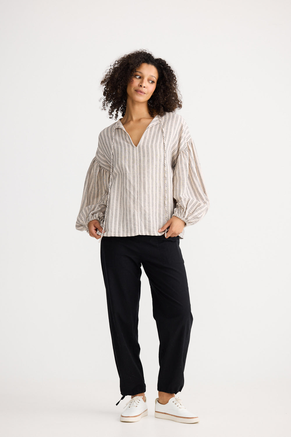 Model wearing natural stitch Copenhagen Top, front view on white background