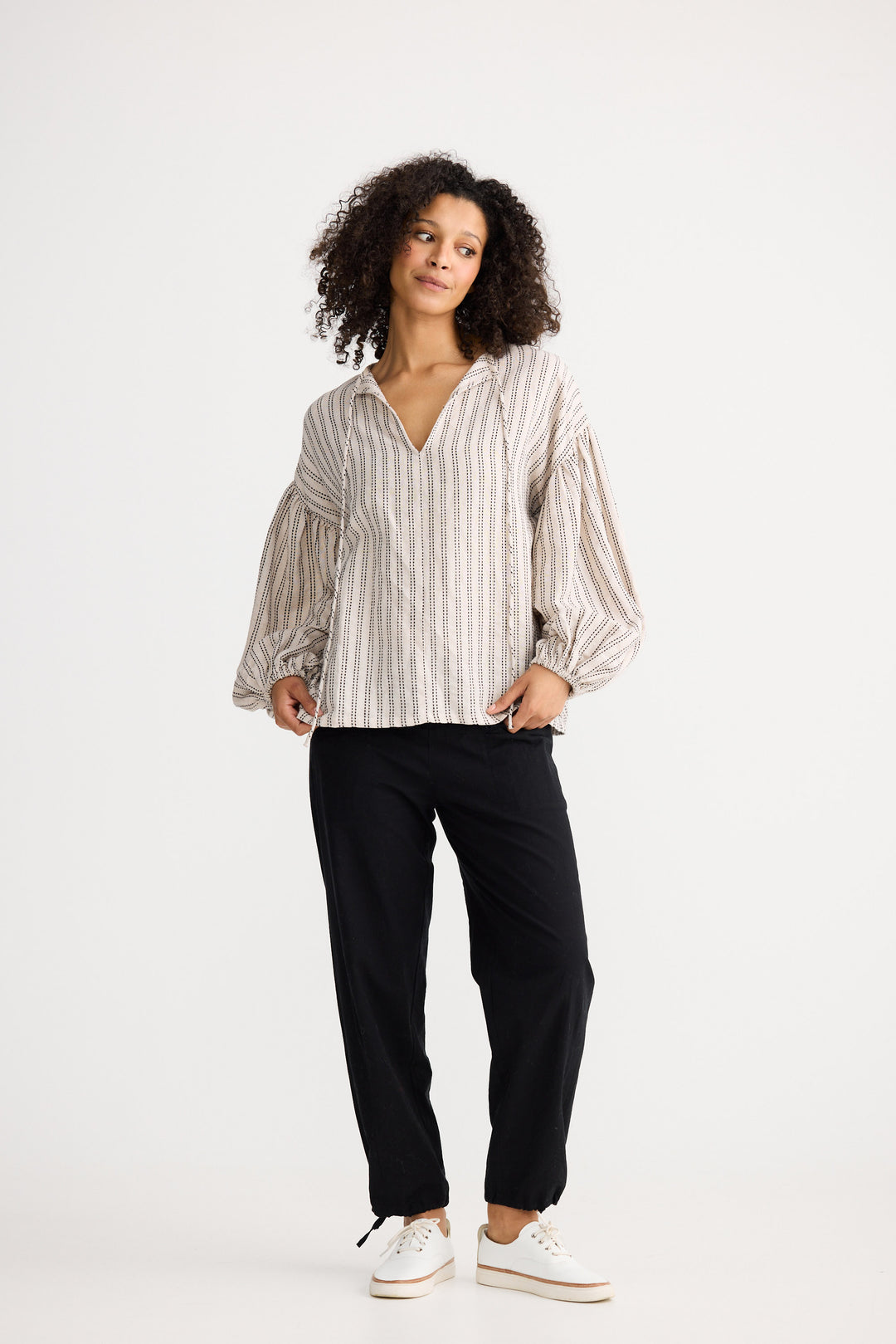 Model wearing natural stitch Copenhagen Top, front view on white background