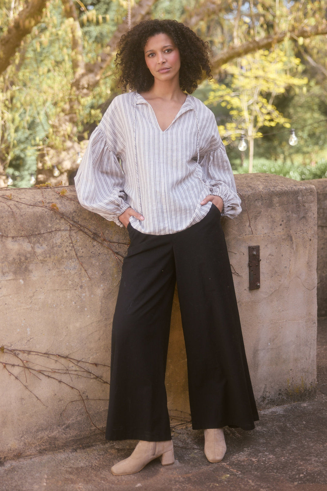 Model wearing natural stitch Copenhagen Top, lifestyle view