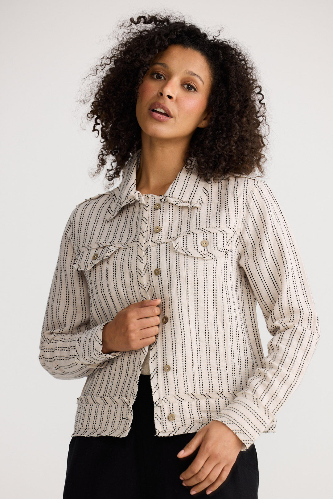 Model wearing natural stitch Monza Jacket, front view on white background