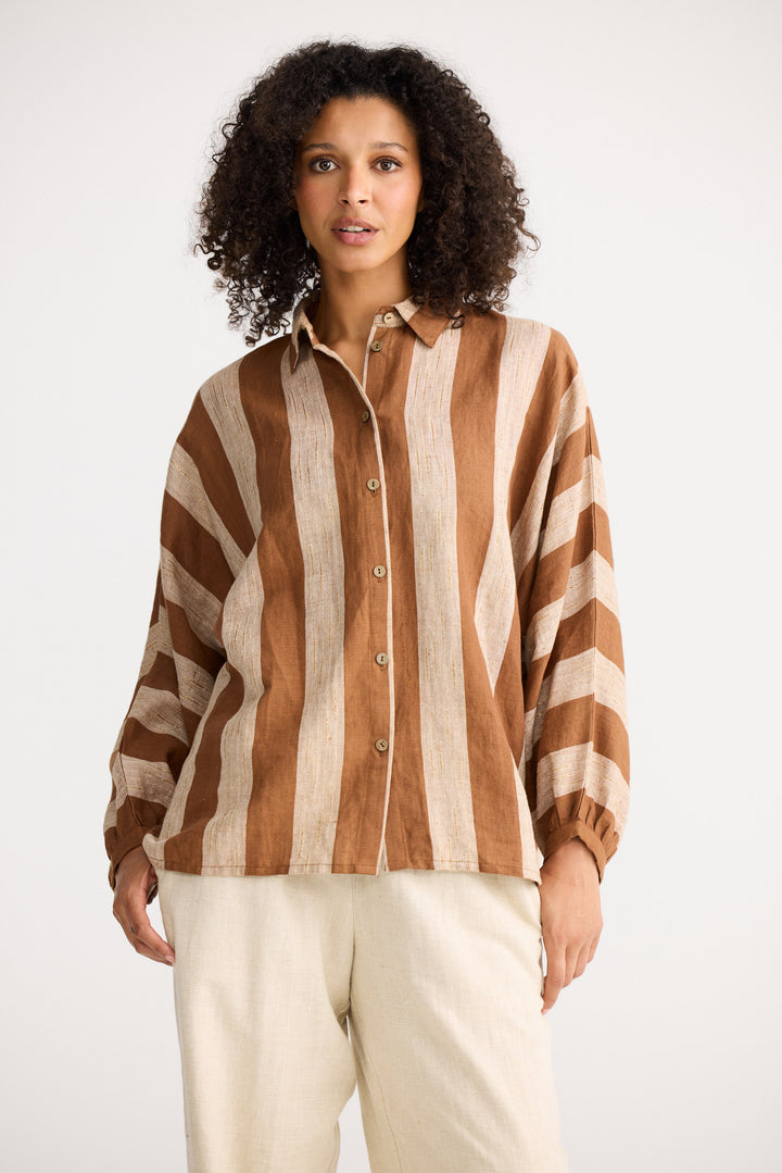 Model wearing sienna stripe Milano Shirt, side view on white background