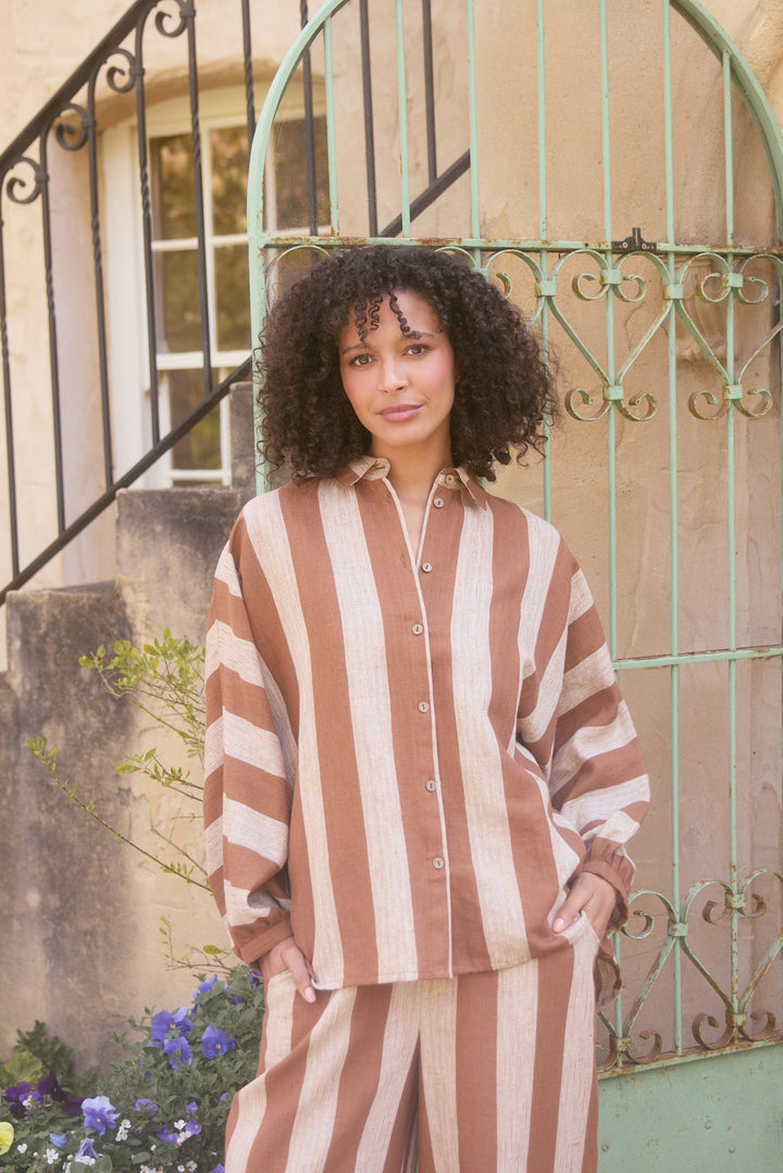 Model wearing sienna stripe Milano Shirt, lifestyle close-up view