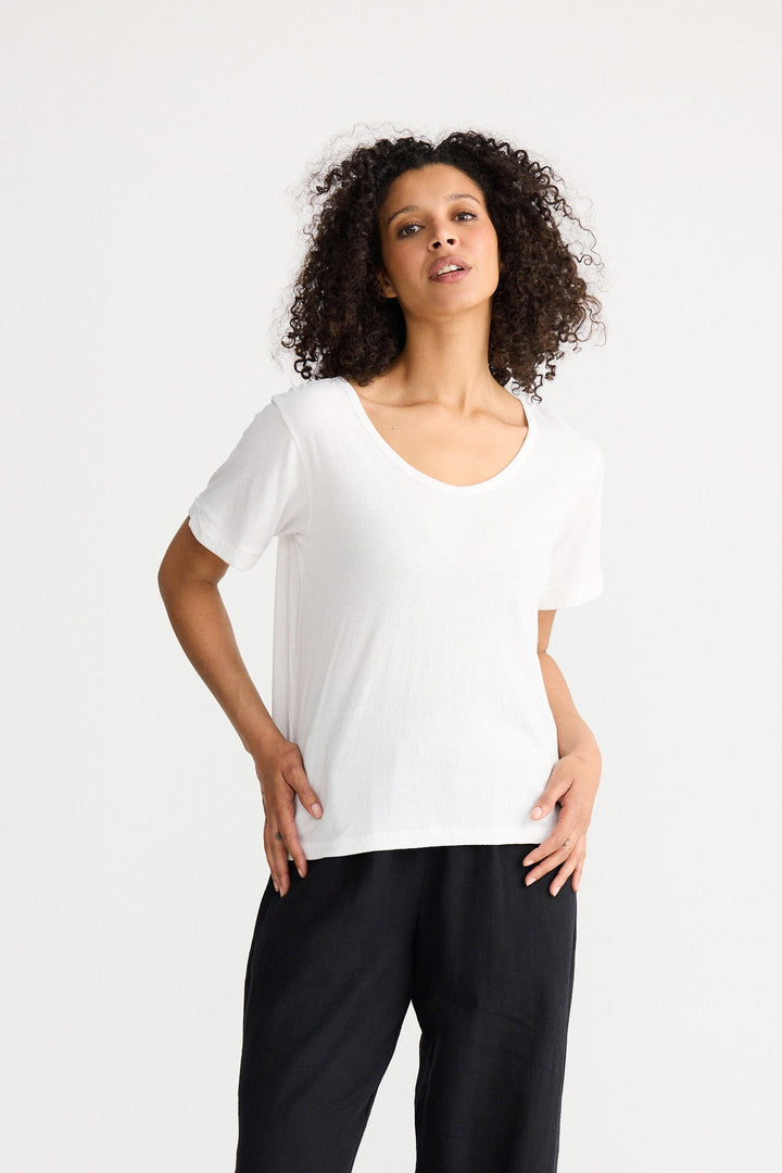 Model wearing ivory Kasai Short Sleeve Tee, front view on white background
