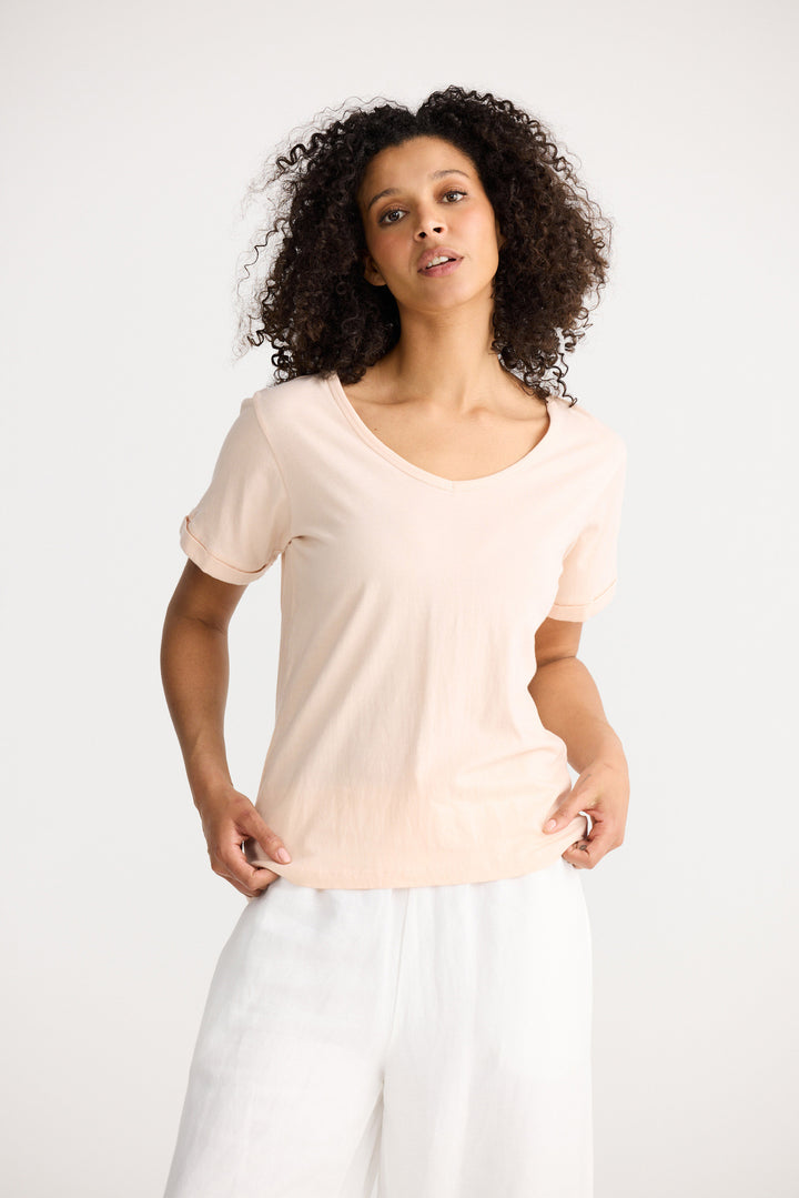 Model wearing peony Kasai Short Sleeve Tee, detail view on white background