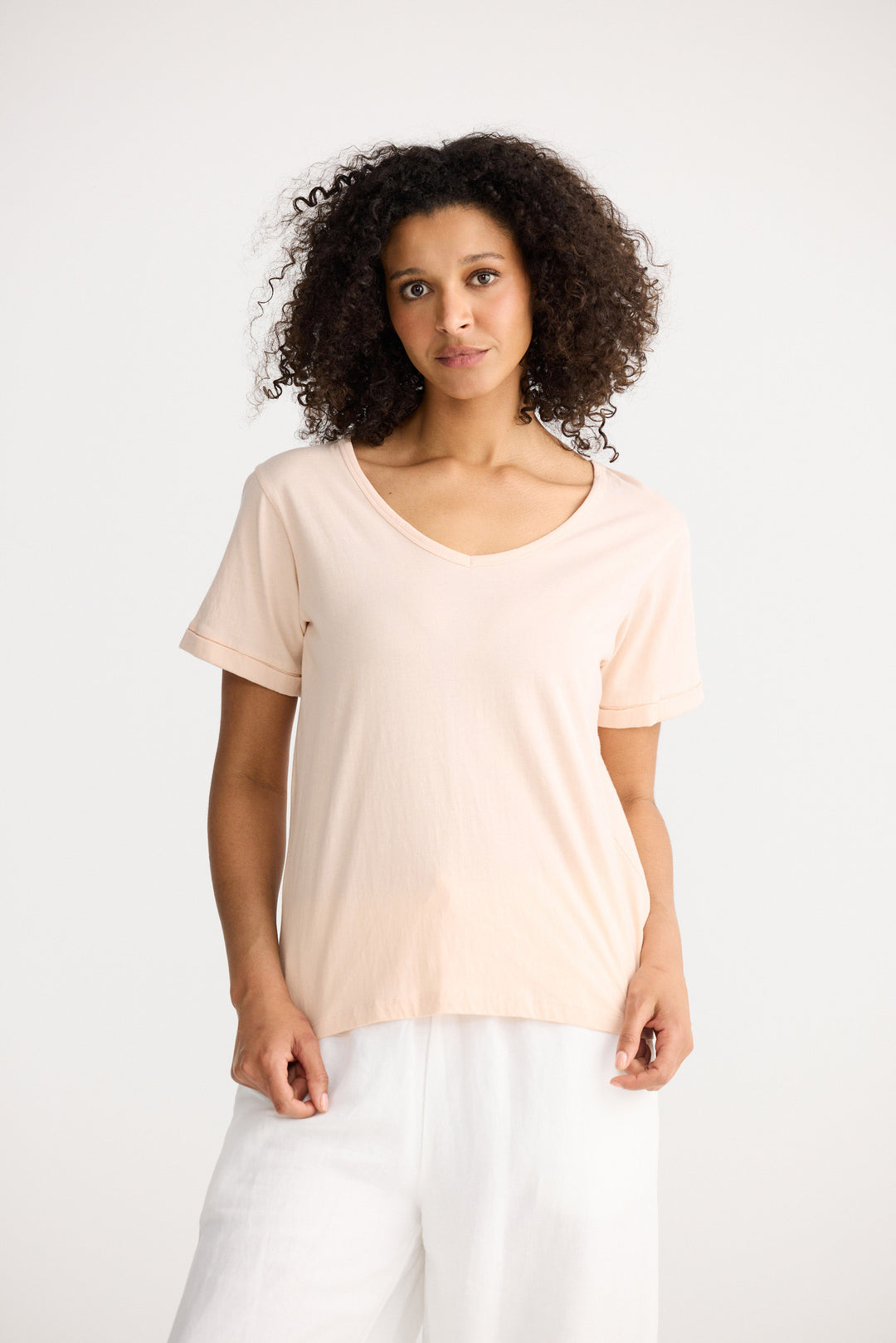 Model wearing peony Kasai Short Sleeve Tee, front view on white background