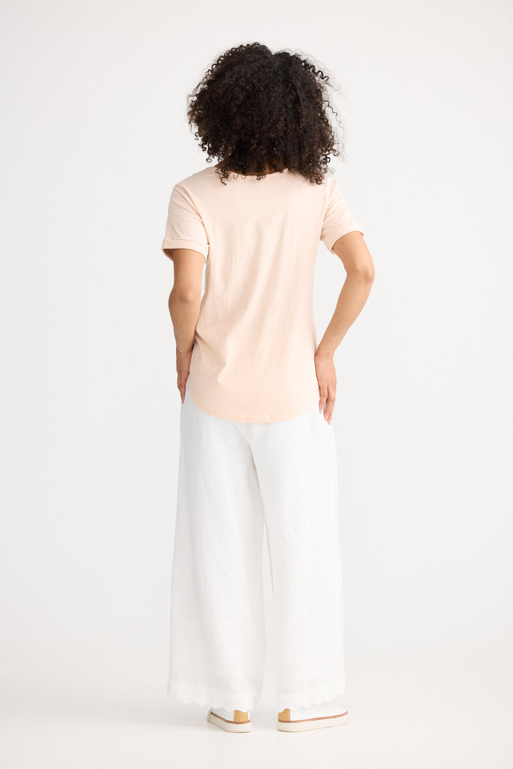 Model wearing peony Kasai Short Sleeve Tee, back view on white background