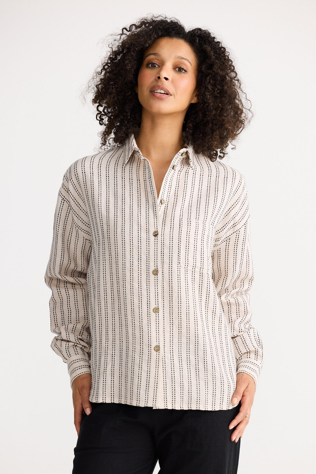 Model wearing natural stitch Morgan Shirt, angled front view on white background