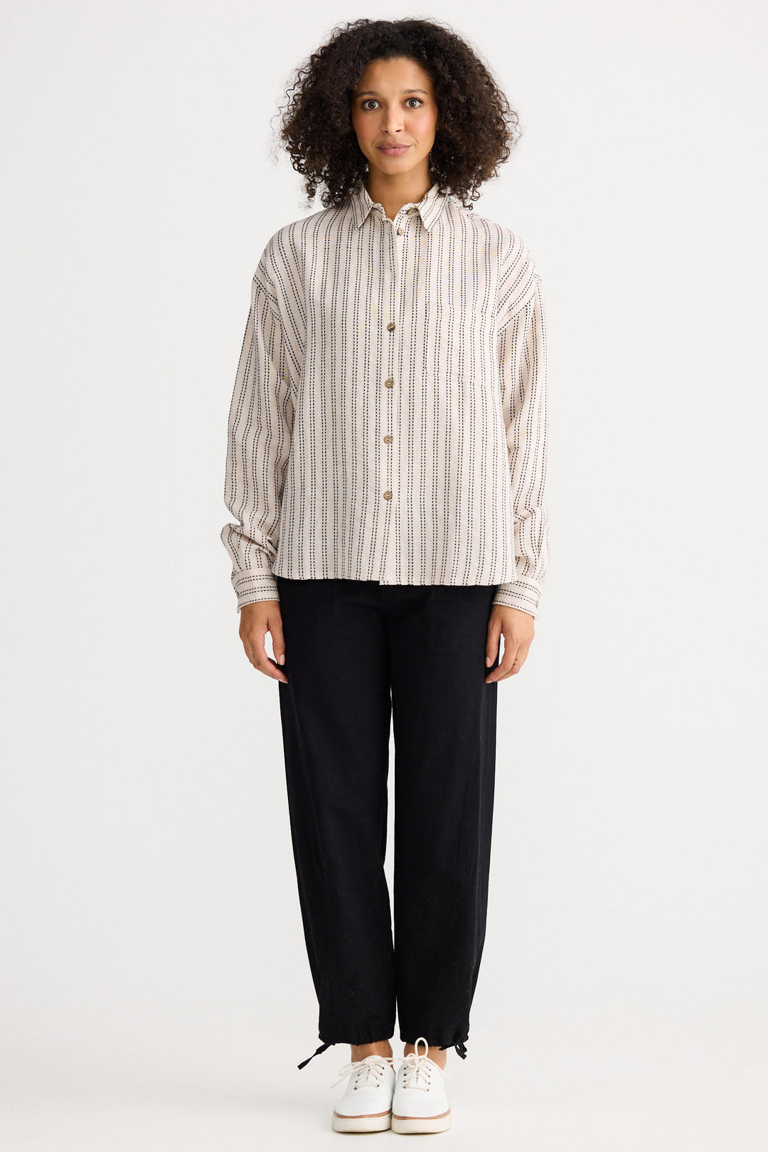 Model wearing natural stitch Morgan Shirt, front view on white background