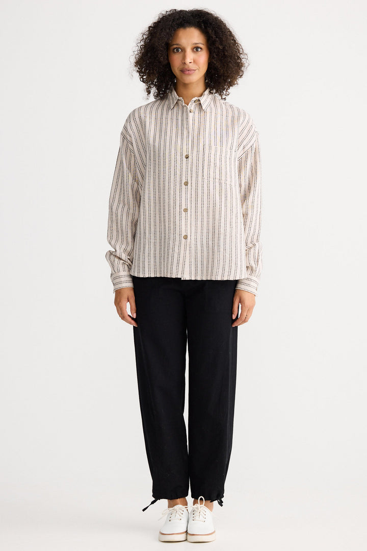 Model wearing natural stitch Morgan Shirt, front view on white background