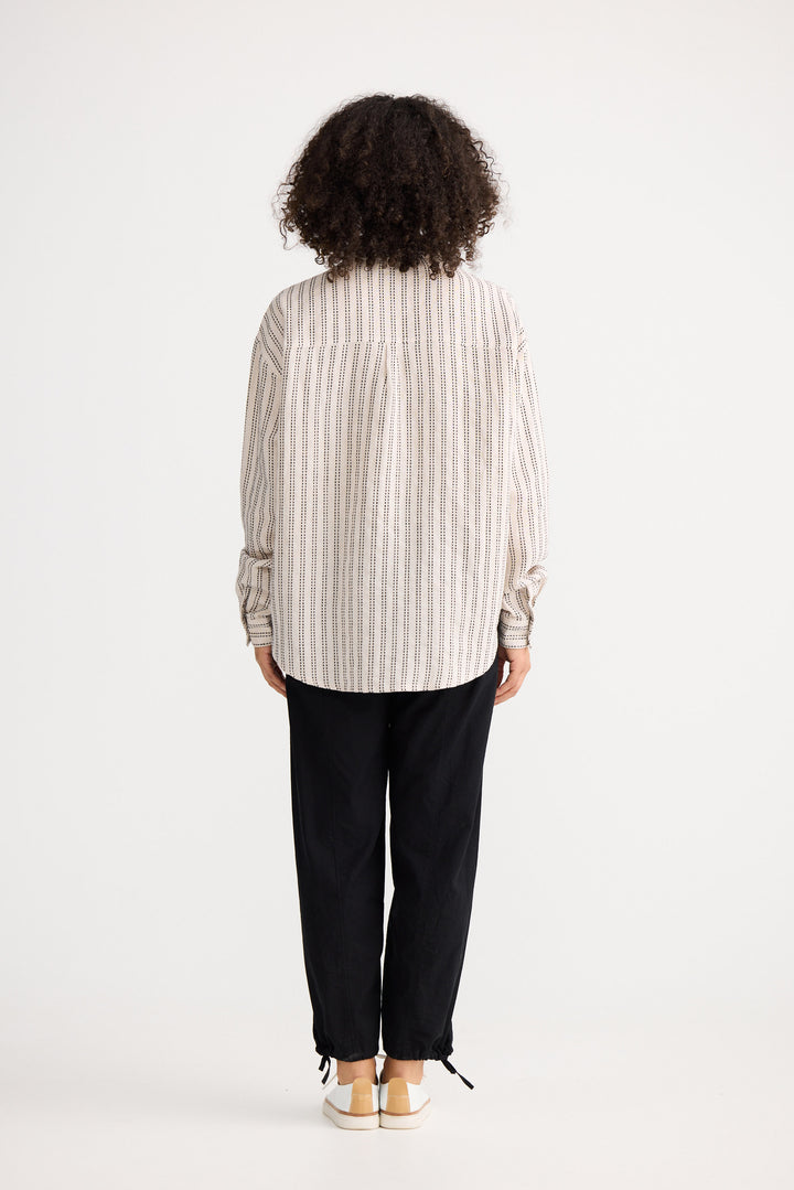 Model wearing natural stitch Morgan Shirt, back view on white background