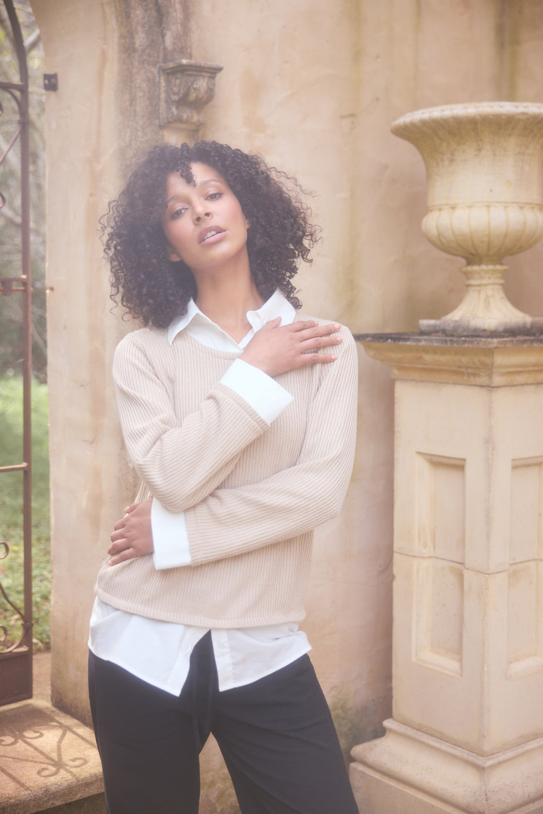 Model wearing natural w white Sorrento Top, lifestyle view