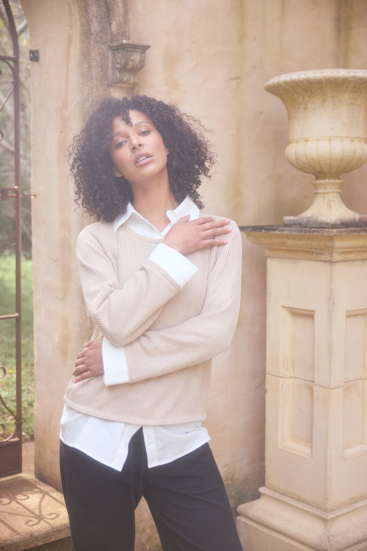 Model wearing natural w white Sorrento Top, lifestyle view