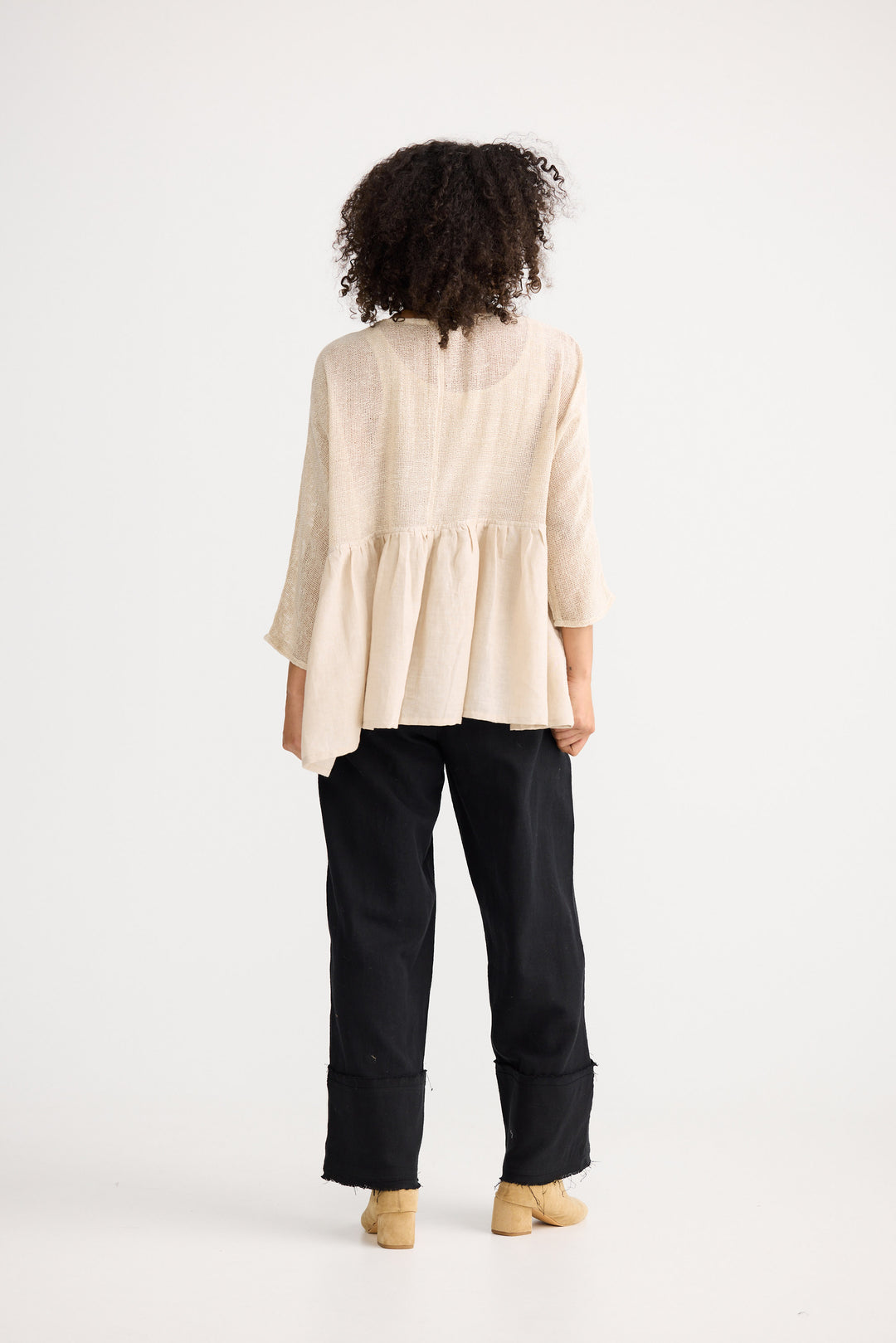 Model wearing natural Nikita Top, front view on white background