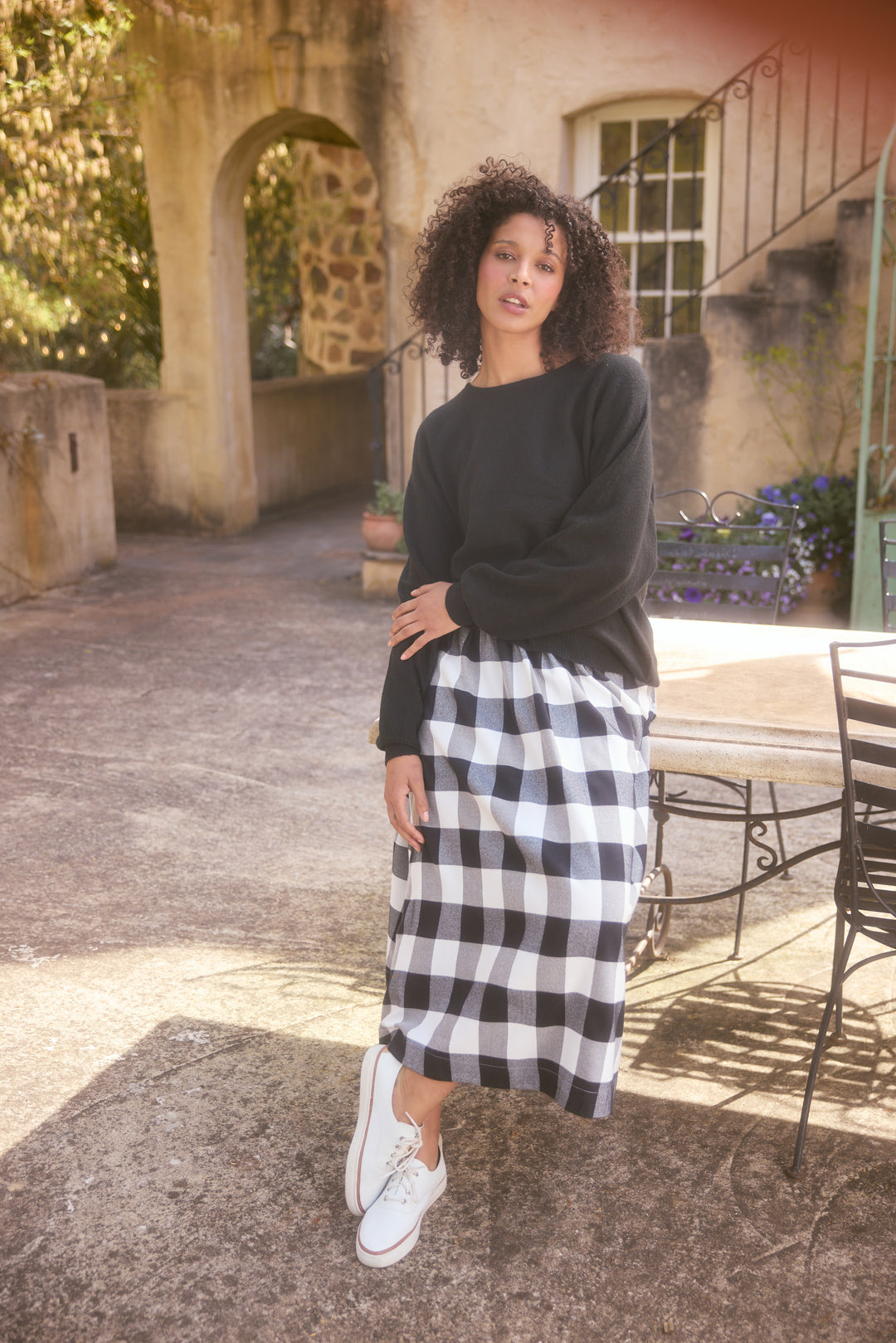 Model wearing charcoal Freddie Knit, lifestyle view