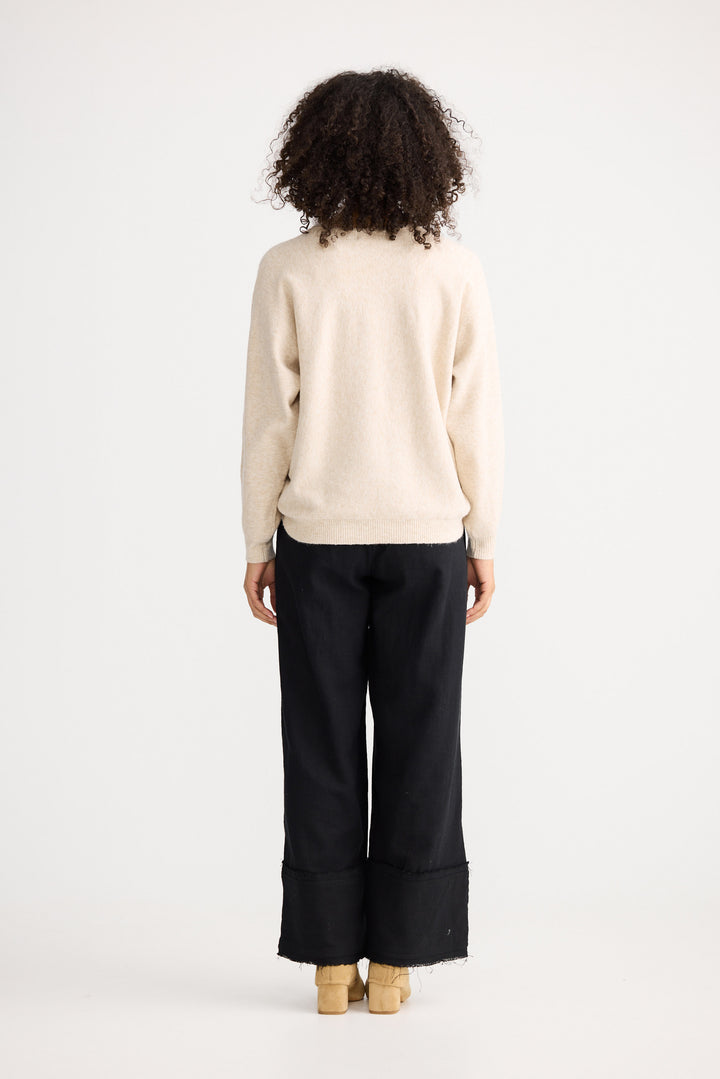 Model wearing oatmeal Freddie Knit, front view on white background