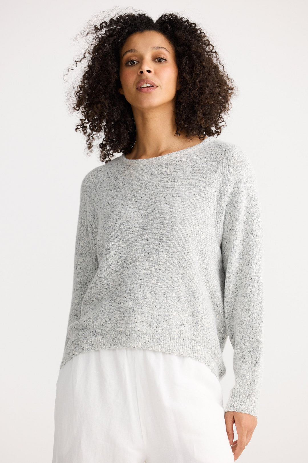 Model wearing grey marle Freddie Knit, back view on white background