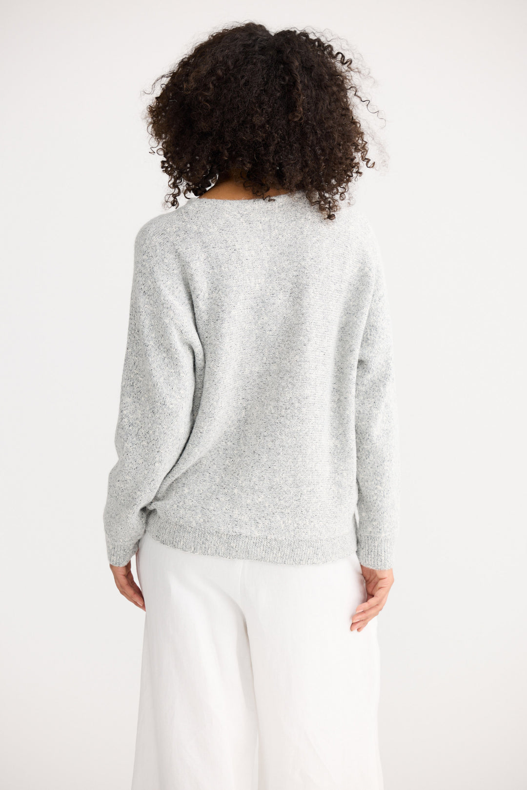 Model wearing grey marle Freddie Knit, front view on white background