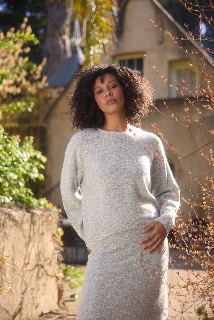 Model wearing grey marle Freddie Knit, lifestyle close-up view