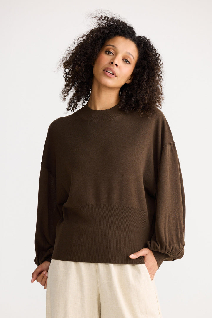 Model wearing chocolate Anais Knit Top, angled front view on white background