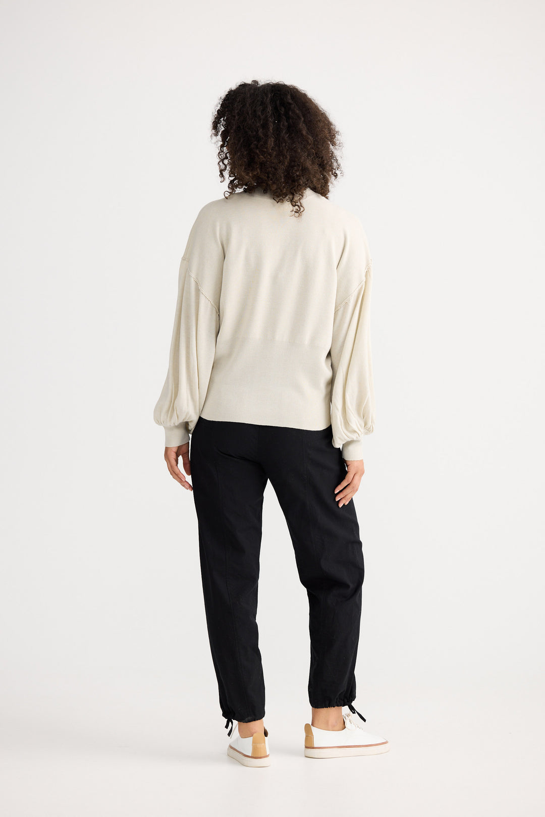 Model wearing oatmeal Anais Knit Top, front view on white background