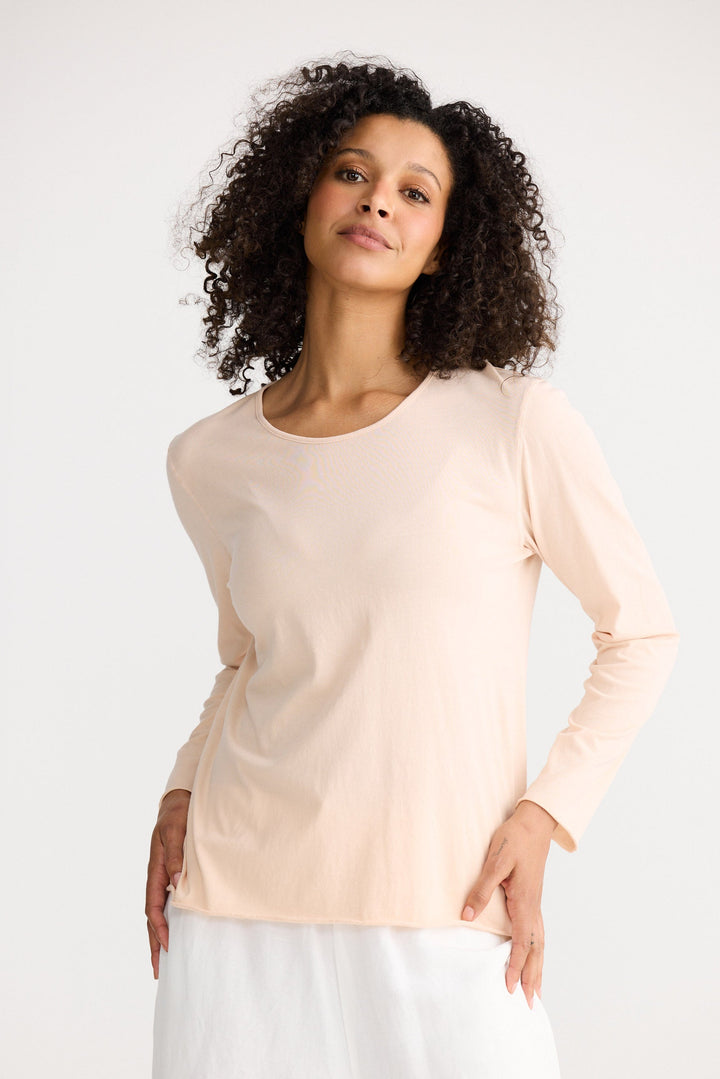 Model wearing peony Kasai Long Sleeve Top, angled front view on white background