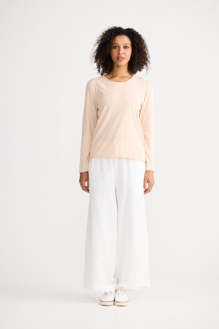 Model wearing peony Kasai Long Sleeve Top, front view on white background