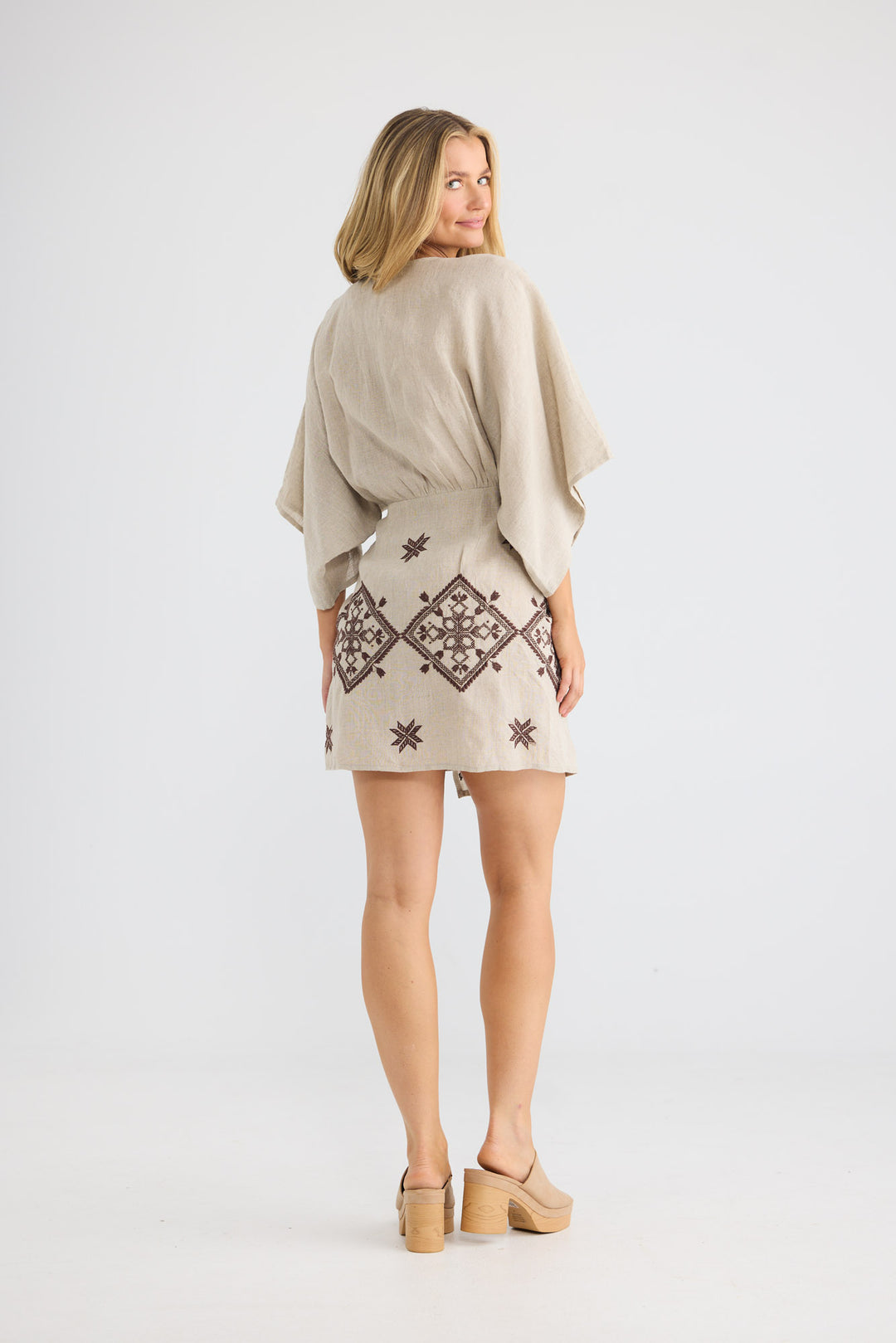 Jeanne Wrap Dress in Natural Linen with a v-shaped neckline.