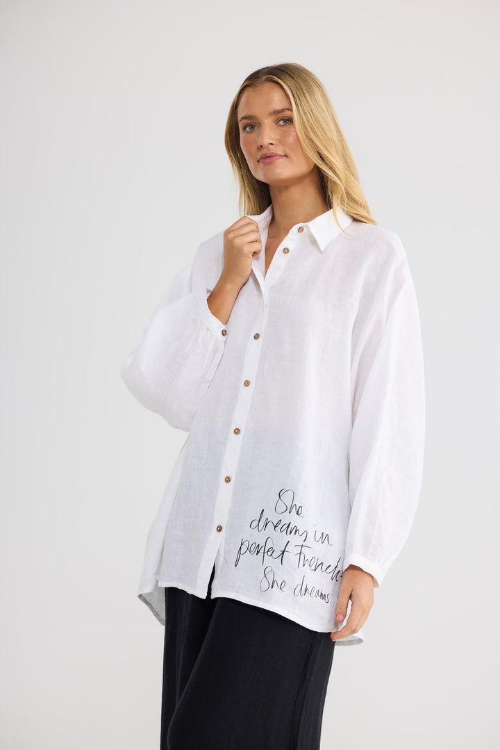 Model wearing Milano Shirt in white linen, front view.