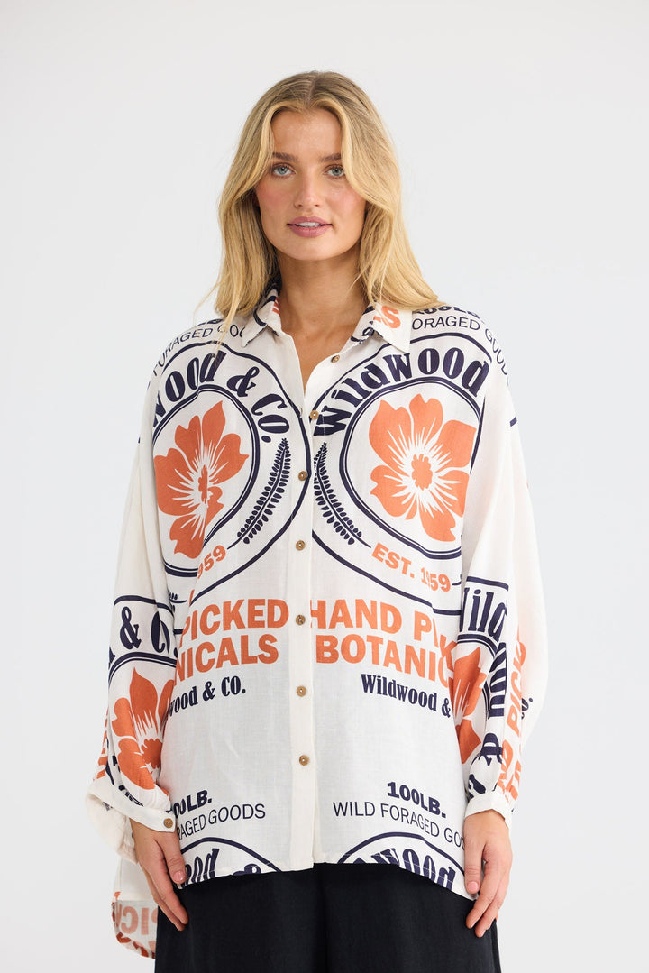 Model wearing Milano Shirt in Hand Picked Botanicals print, front view.