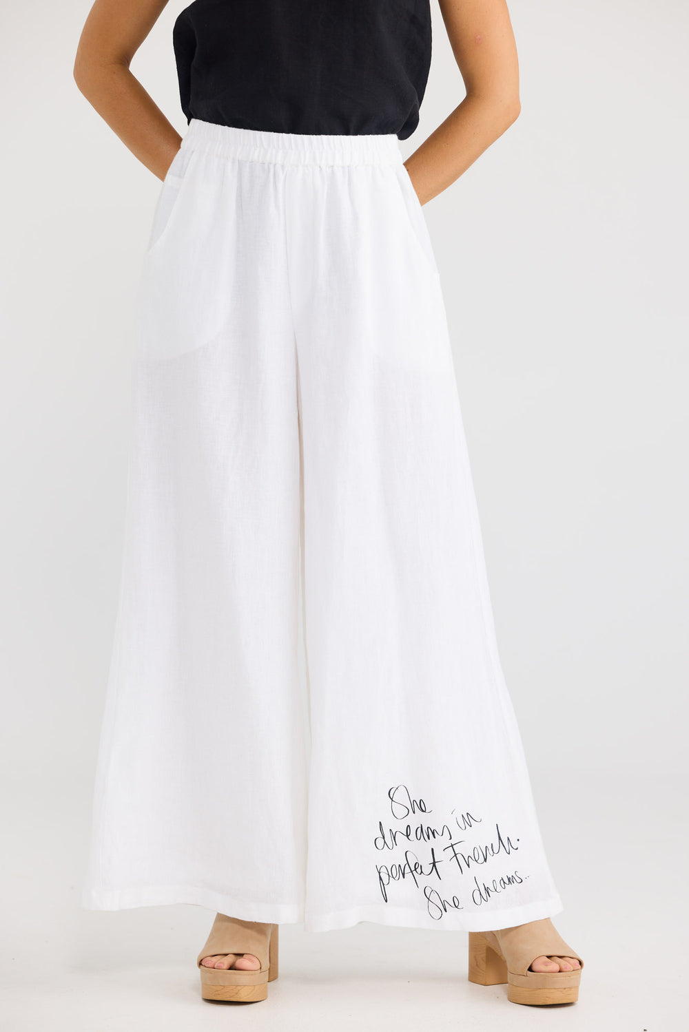 Positano Pants in White Linen with a mock fly front.