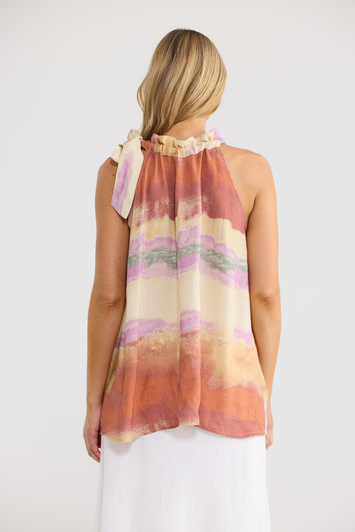 Model wearing Lucia Top in Sand Dunes print, front view.