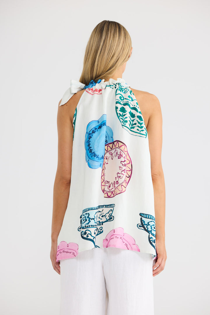 Model wearing Lucia Top in Perfect French print, front view.