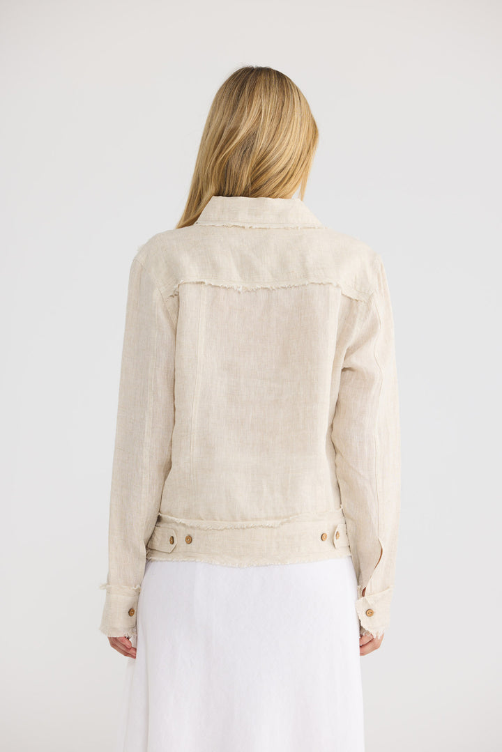 Model wearing Monza Jacket in natural linen with frayed trim, front view.