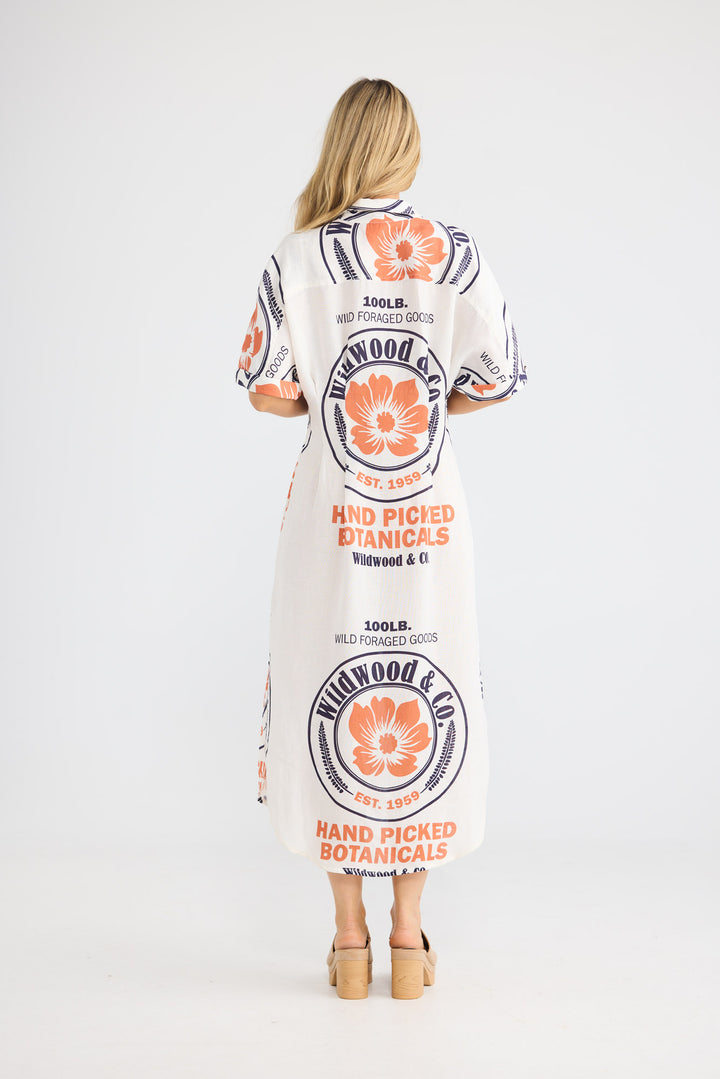 Felicita Dress in Hand Picked Botanicals with a button-through front closure.
