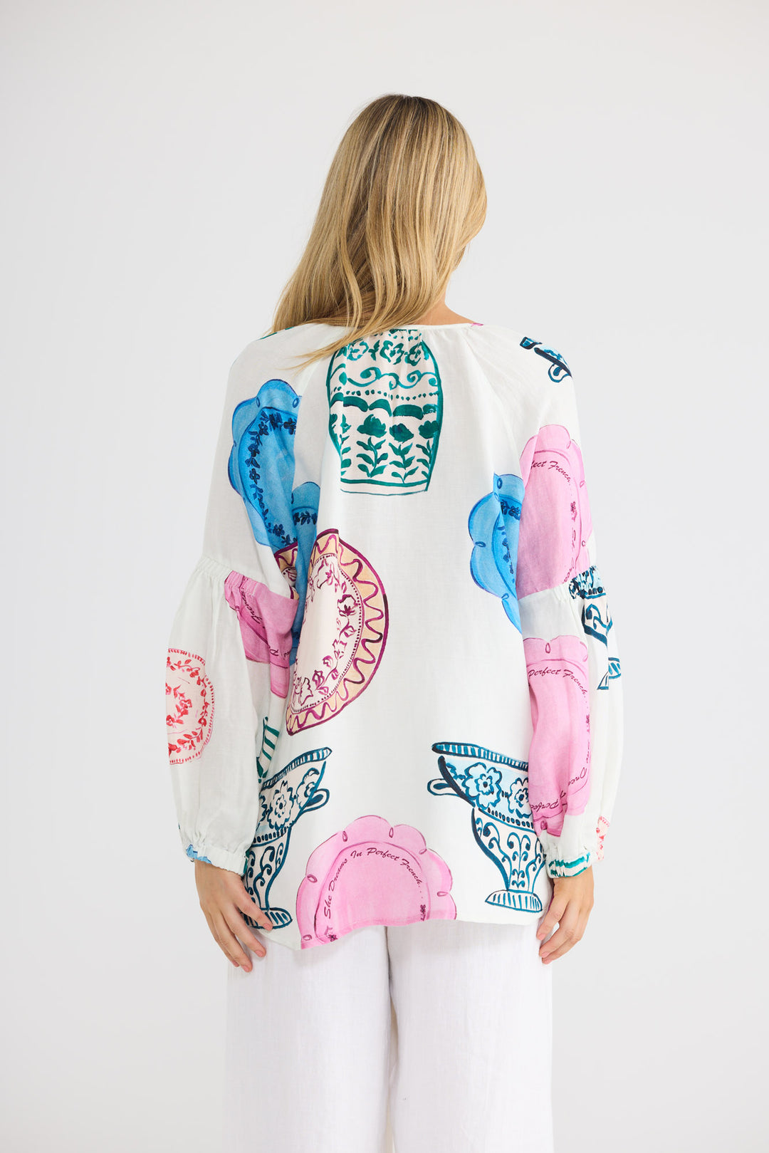 Model wearing Salerno Top in Perfect French print, front view.