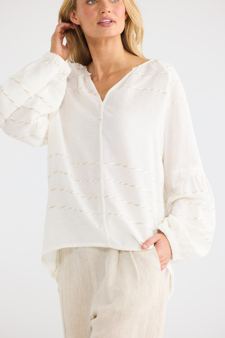 Model wearing Salerno Top in Cloud Stripe, front view.