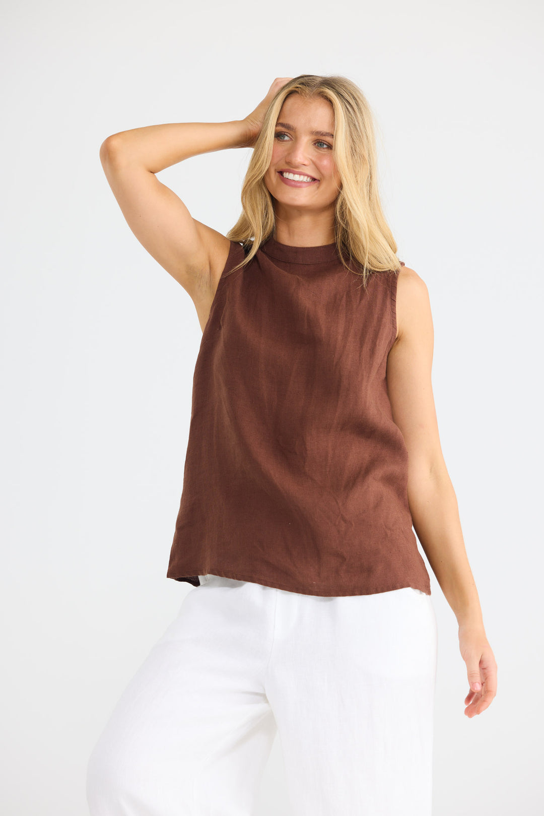 Model wearing Adel Top in chocolate linen, front view.