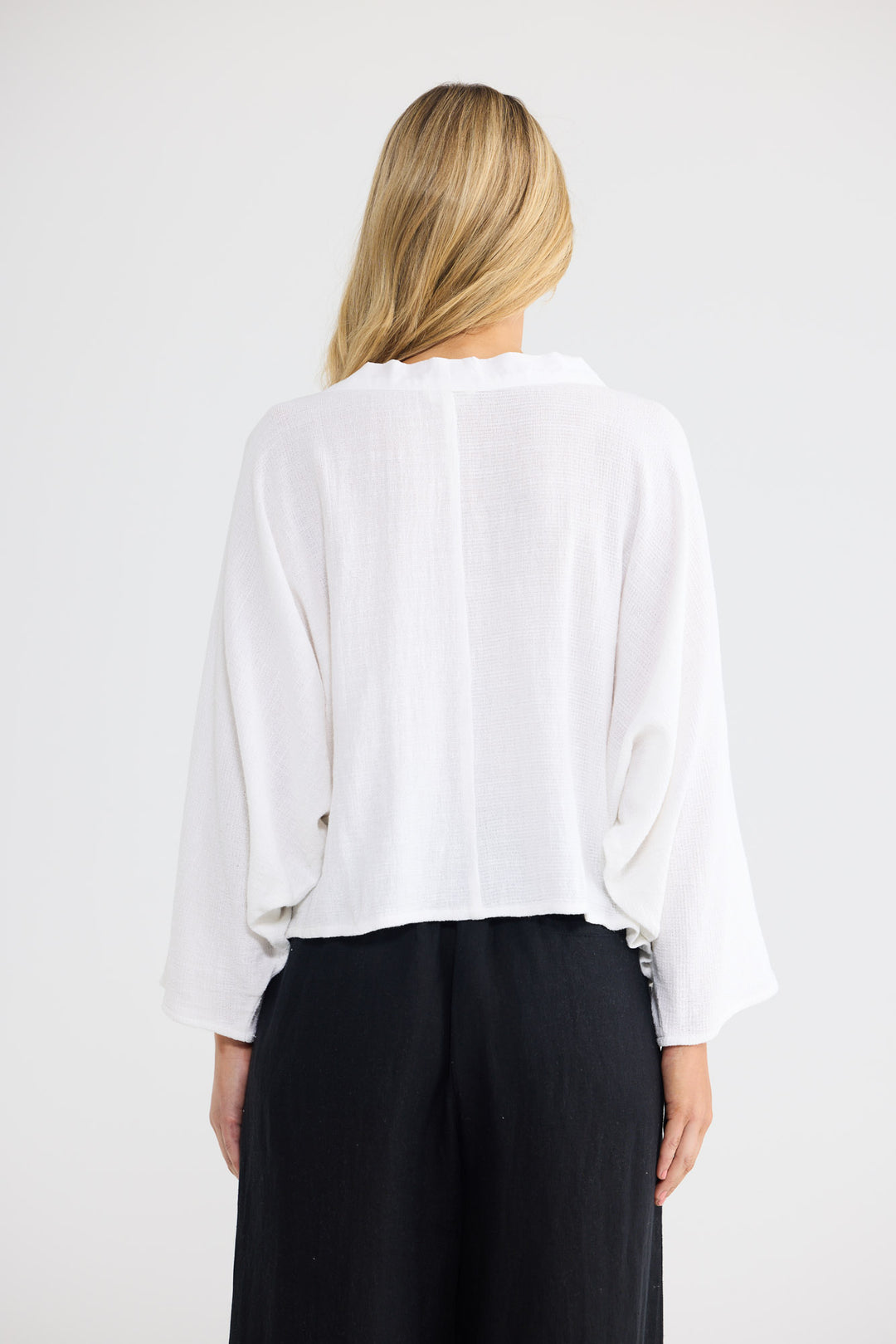 Model wearing Giorgio Overshirt in white, front view.