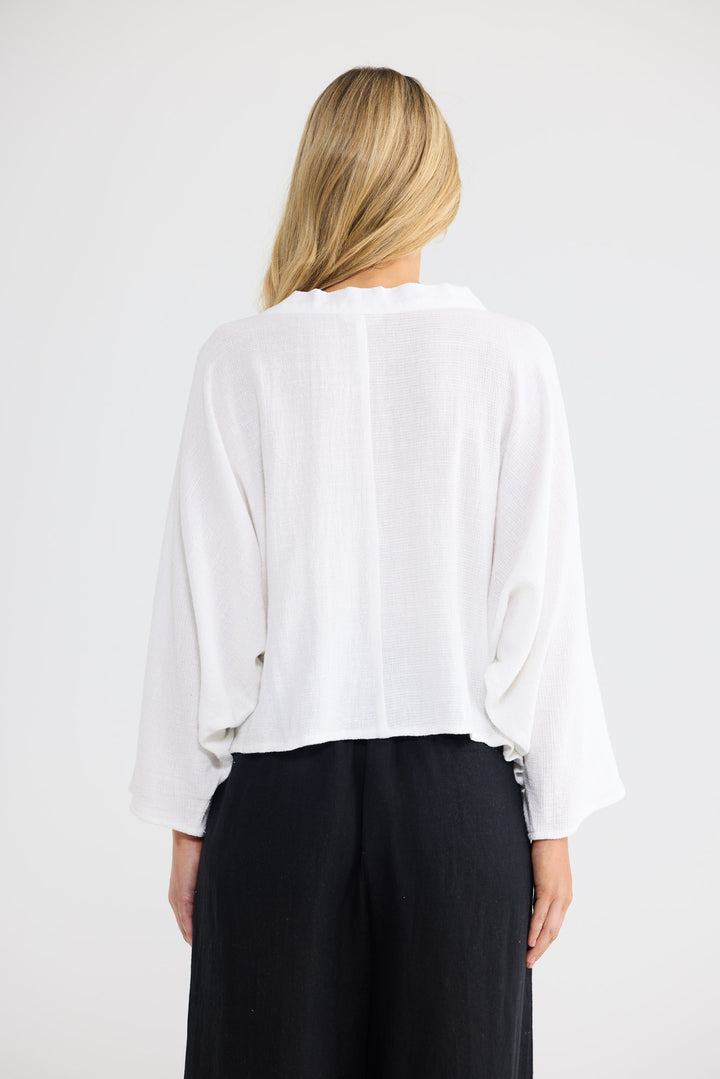 Model wearing Giorgio Overshirt in white, front view.