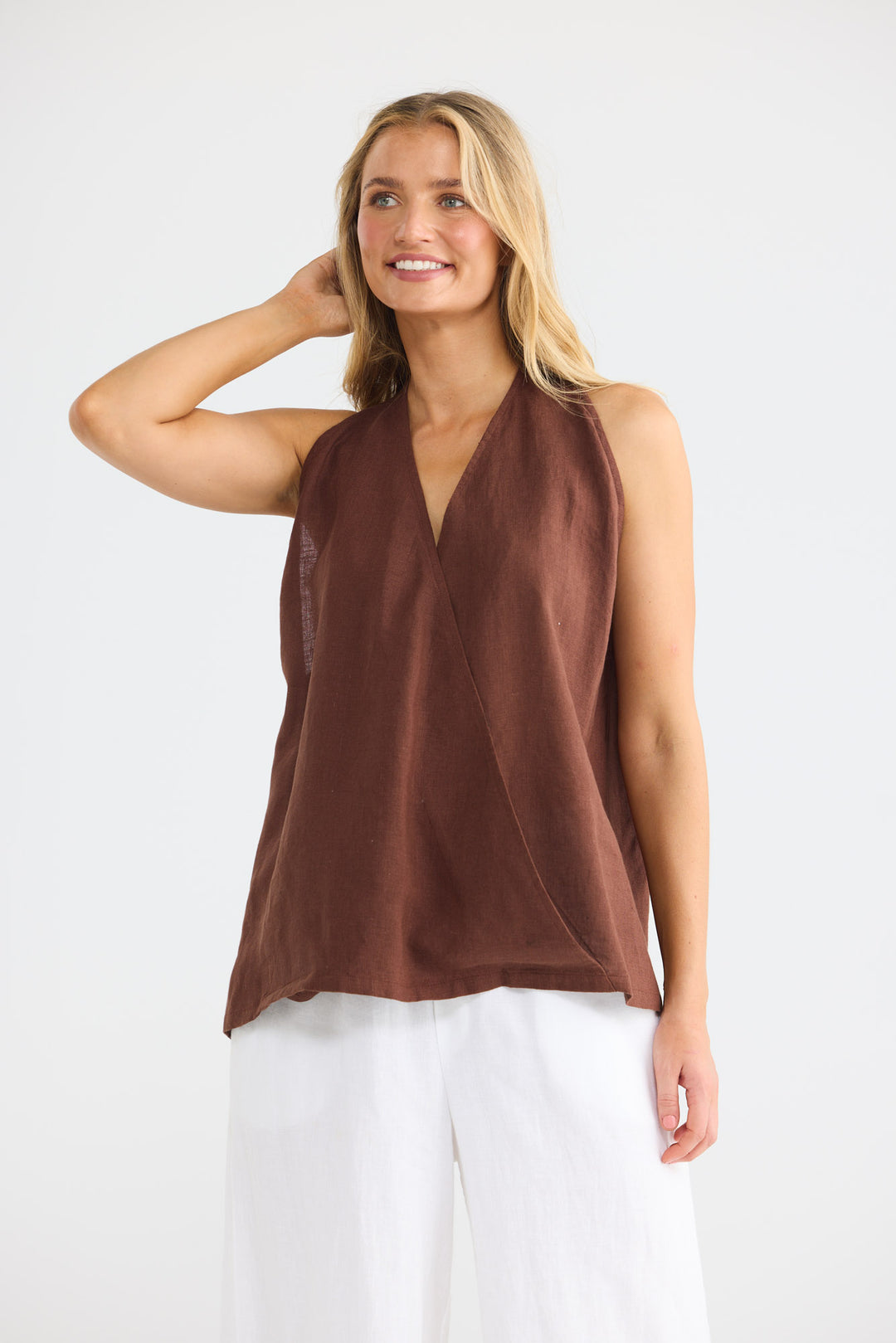 Model wearing Marais Top in chocolate linen, front view.