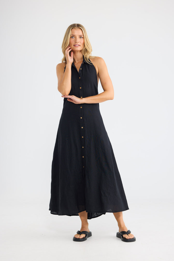 Rivage Dress in Black Linen with a button-through front closure.